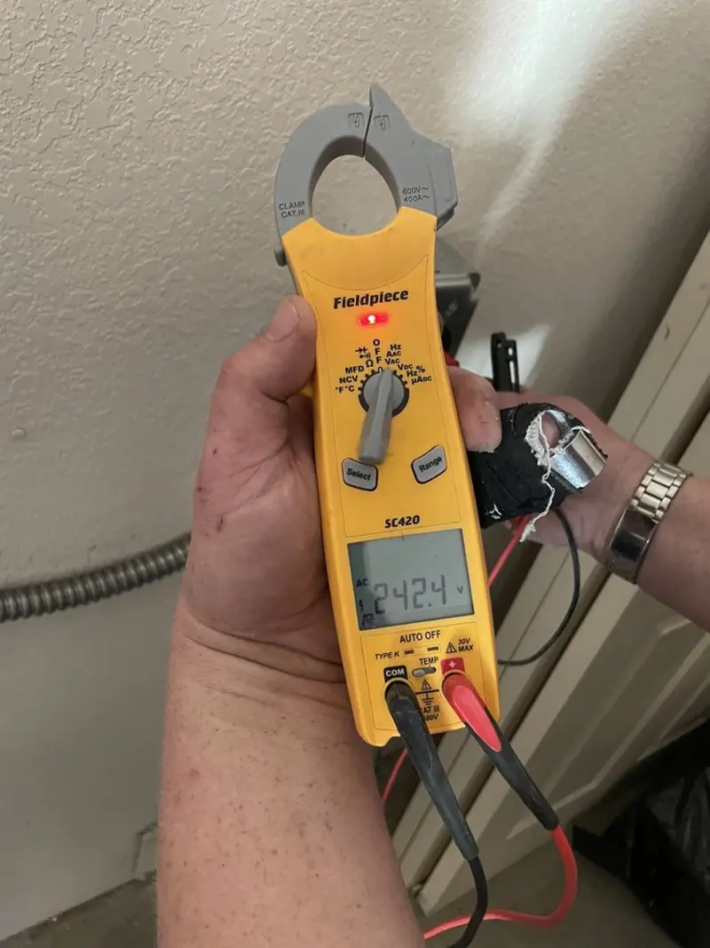 Voltage testing with clamp meter during Recessed Lighting Installation in Old Forge
